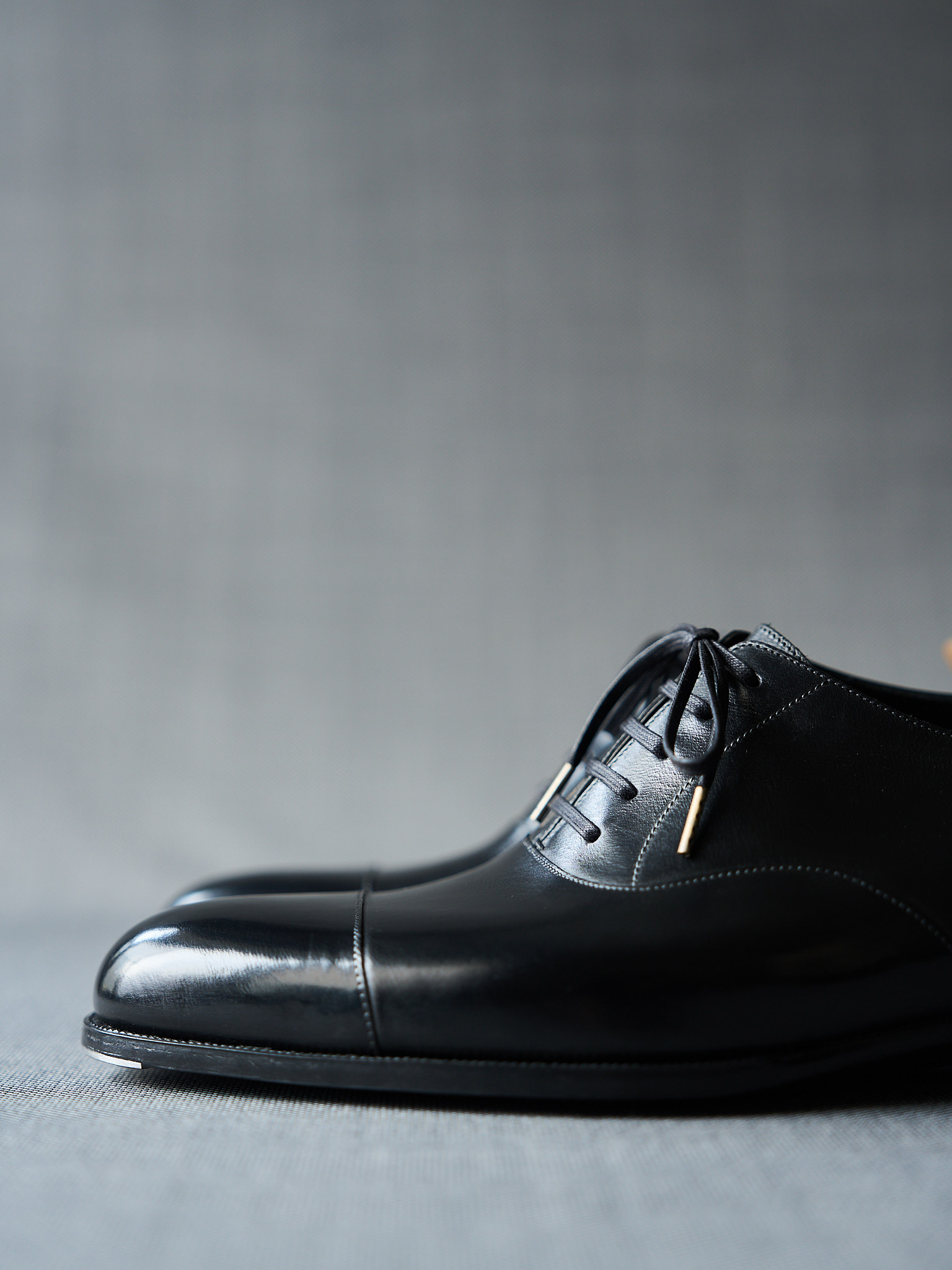 Black leather dress shoes with polished finish for formal occasions.