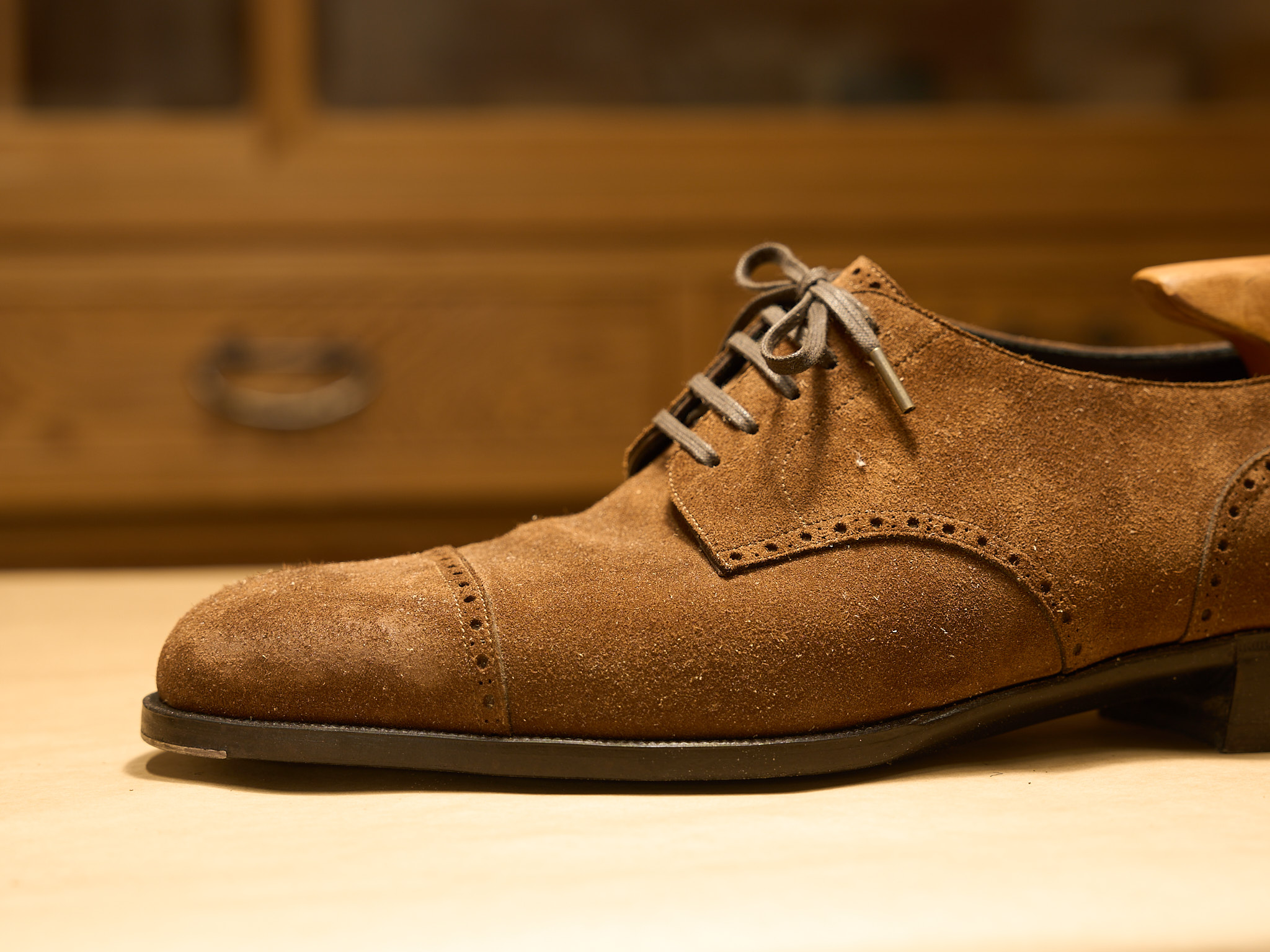 Suede shoes covered in dust