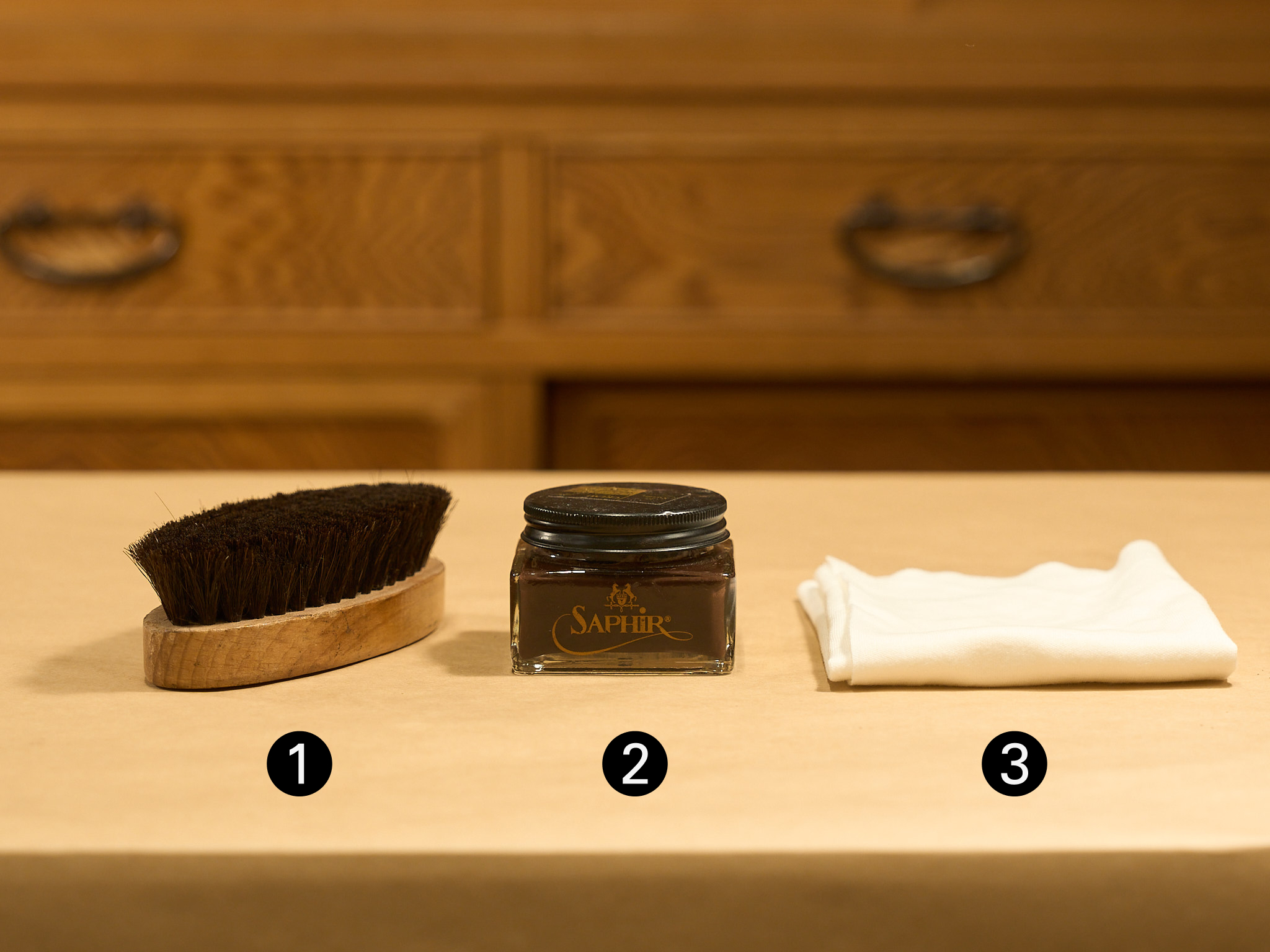 Saphir shoe care kit with a horsehair brush, cream, and a polishing cloth