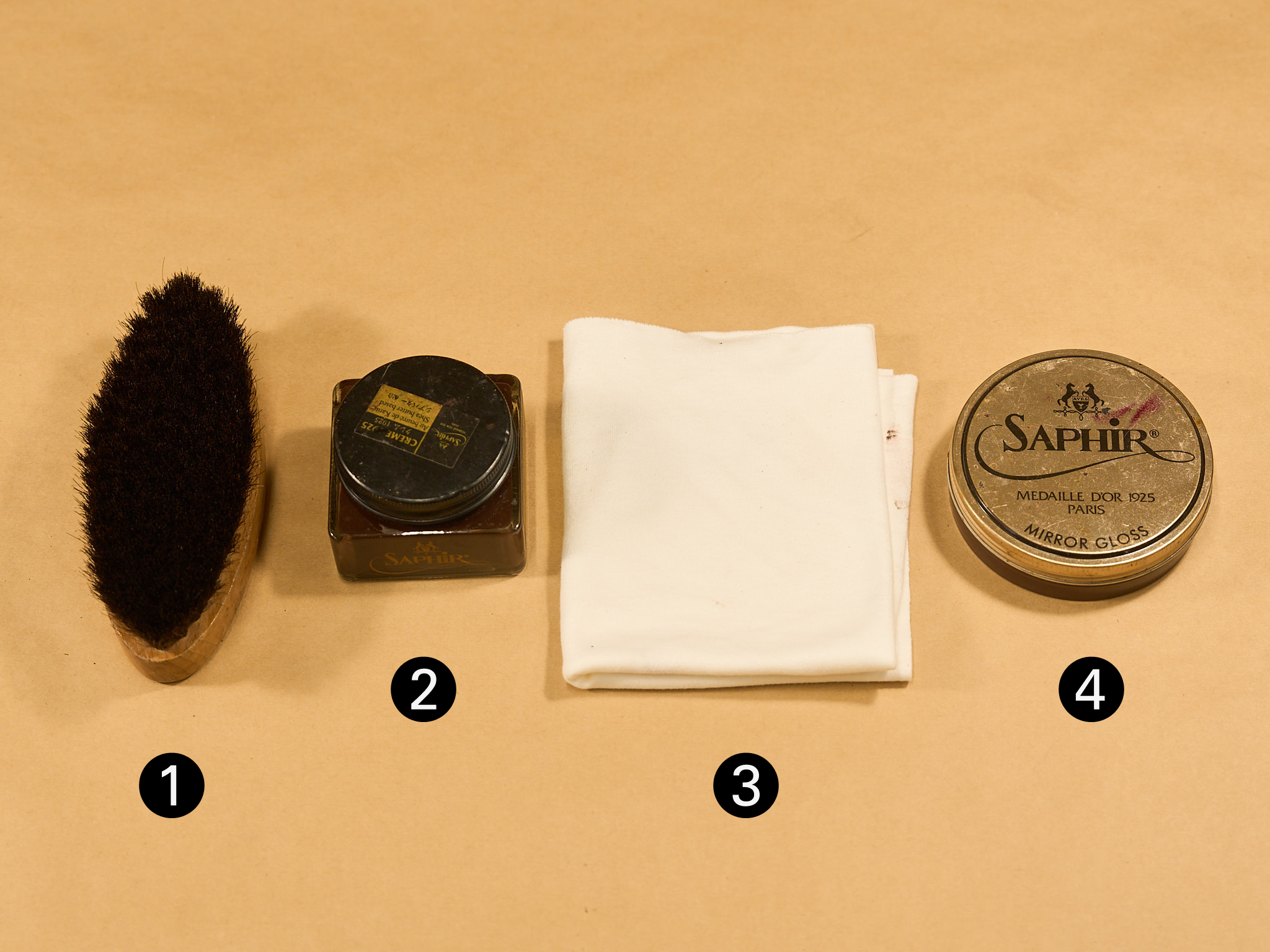 Saphir shoe care kit with horsehair brush, cream, wax, and a polishing cloth