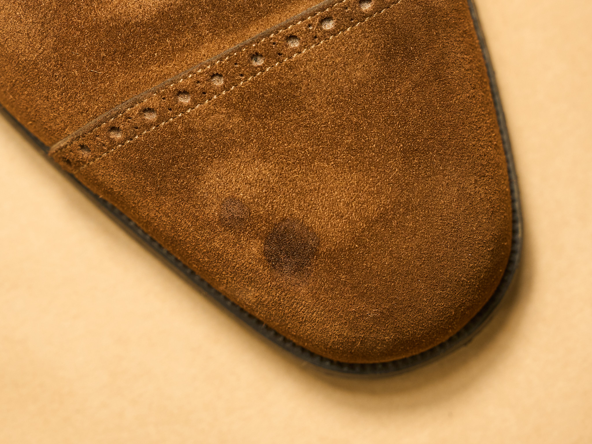 Oil stains on a suede shoe