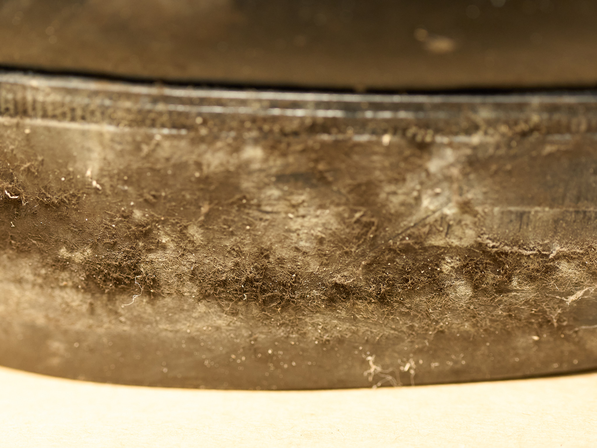 Black mold stains on a worn leather boot